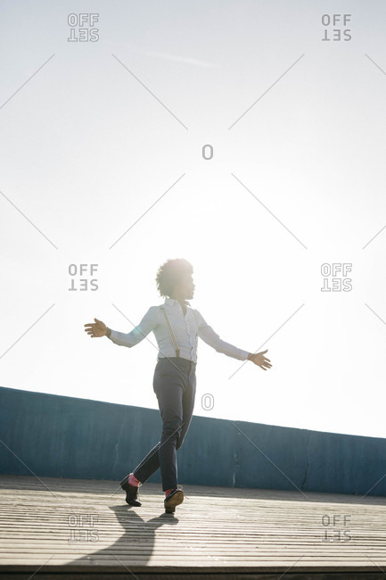 Man dancing at backlight