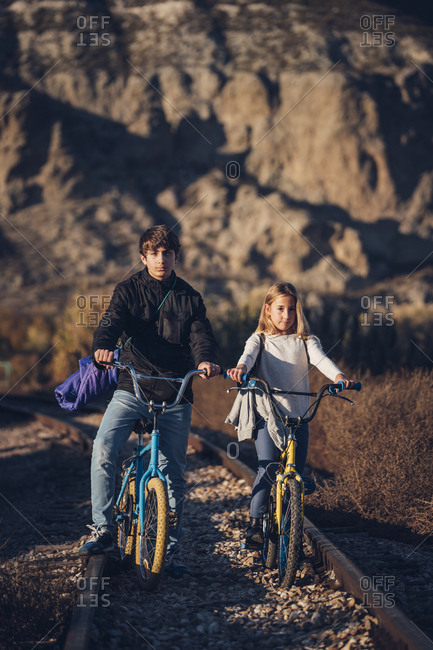 Boy And Girl On The Train Track With Bicycles Stock Photo Offset