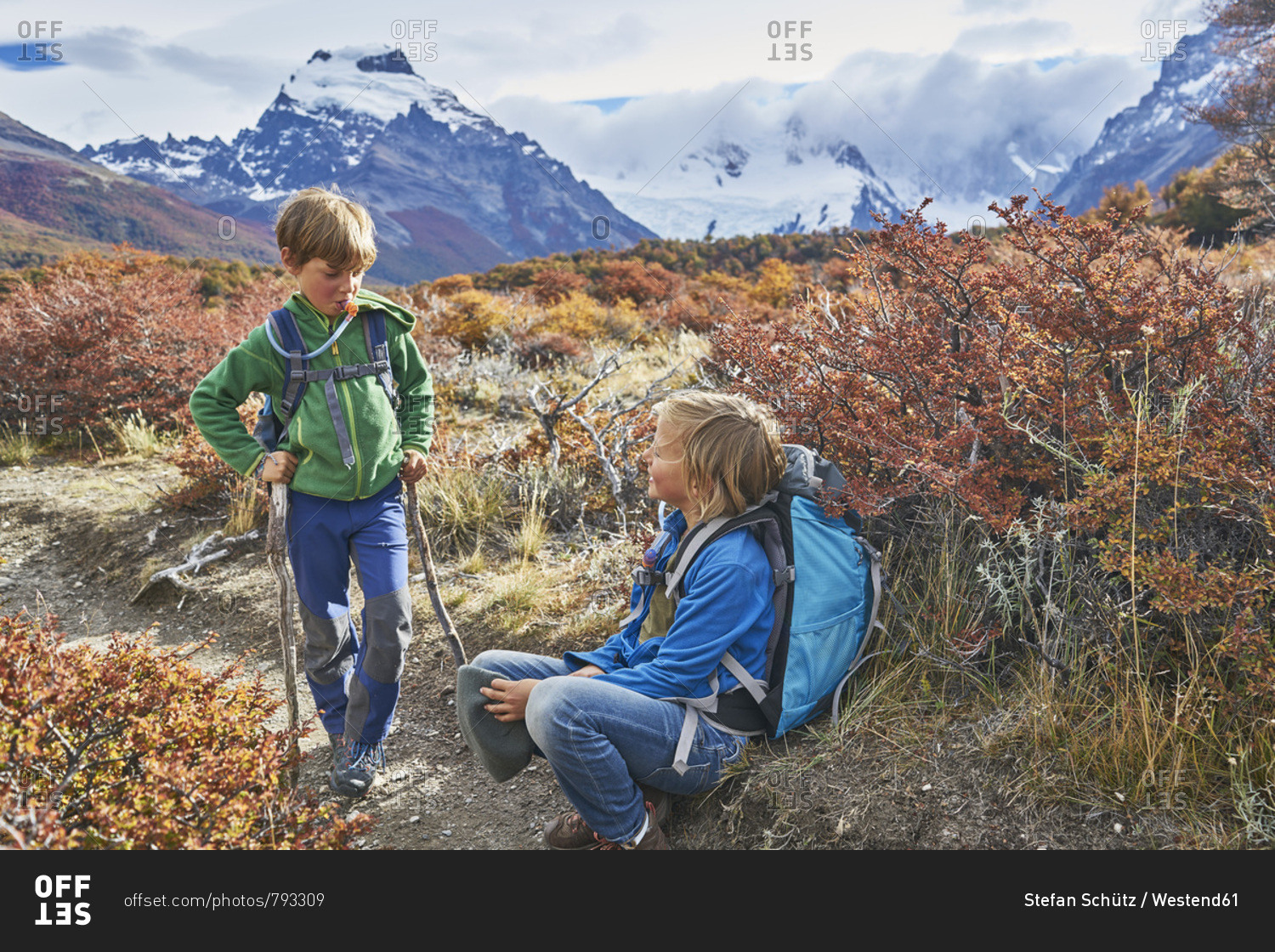 Argentina- Patagonia- El Chalten- two boys having a break from hiking in Los Glaciares National park