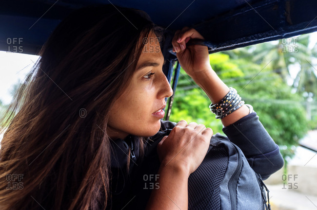 Woman traveling on a tricycle in Bohol, Philippines