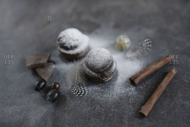 Chocolate treats with powdered sugar and cinnamon sticks