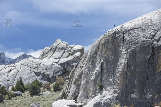 A rock climber atop Elephant Rock in City of Rocks National Reserve