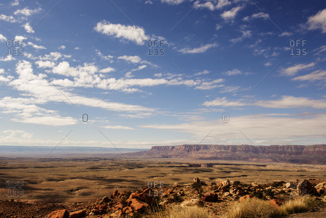 View of vast desert landscape and red rock formations