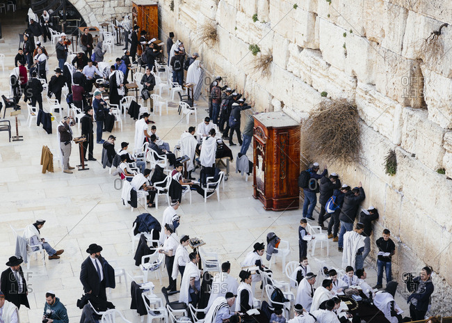 January 21, 2019: Jewish men praying at the wailing wall known also as the western wall in the old city, Jerusalem, Israel.