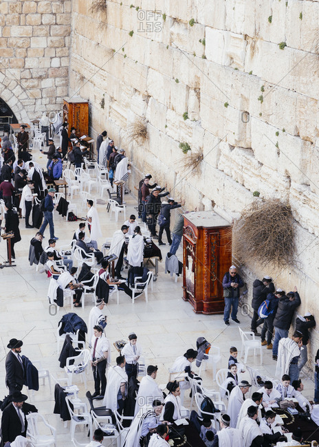 January 21, 2019: Jewish men praying at the wailing wall known also as the western wall in the old city, Jerusalem, Israel.