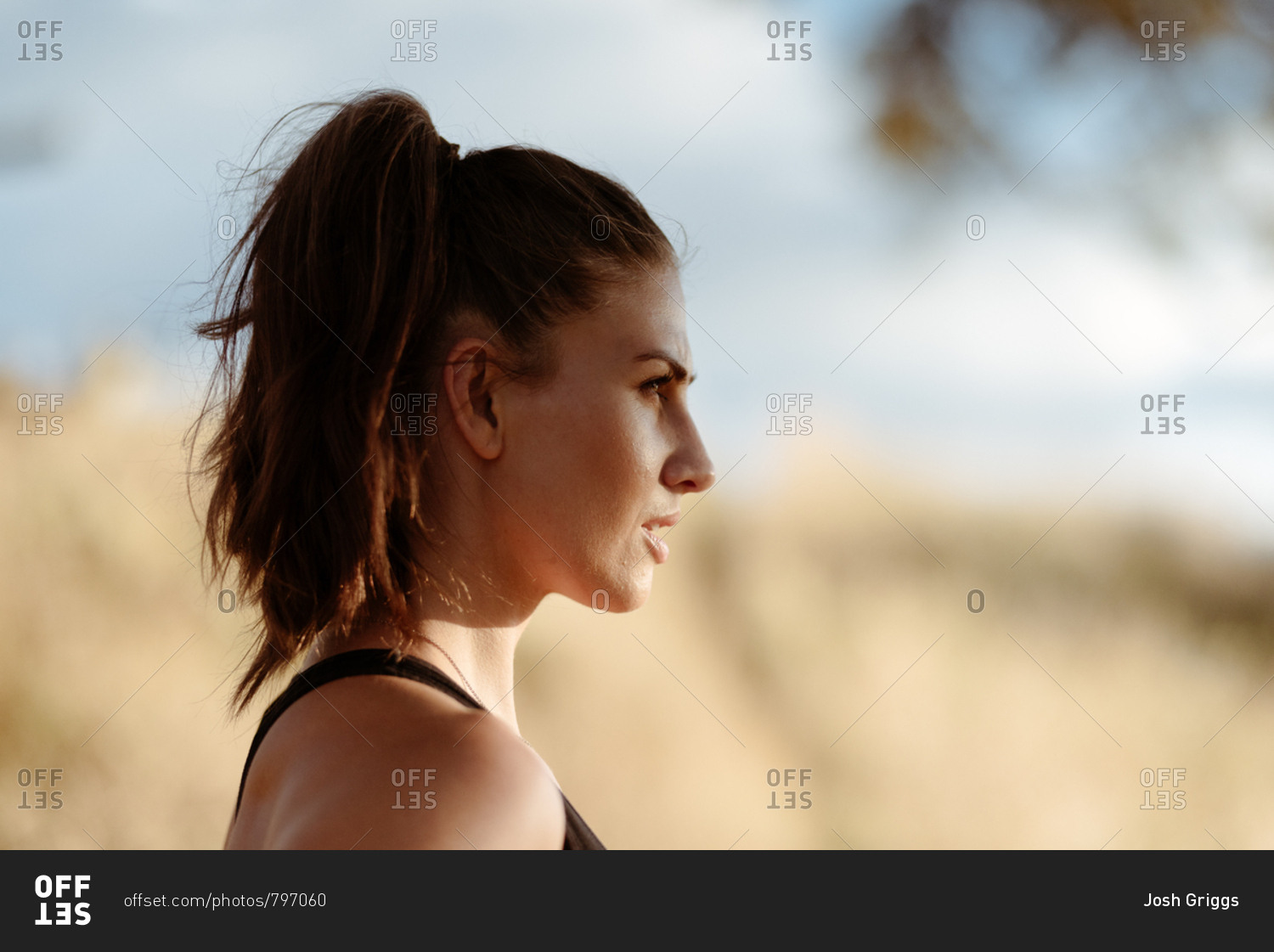 Profile view of young woman in workout clothes