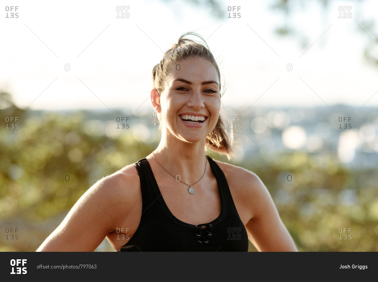 Happy young woman in workout clothes