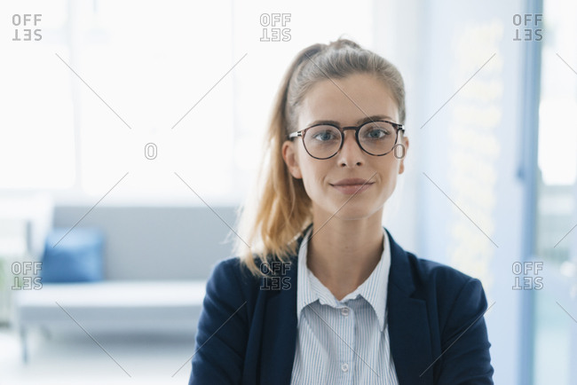 Portrait of a confident young businesswoman- standing in office