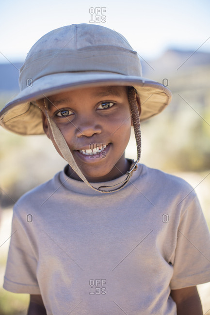 Portrait of smiling boy wearing pith helmet
