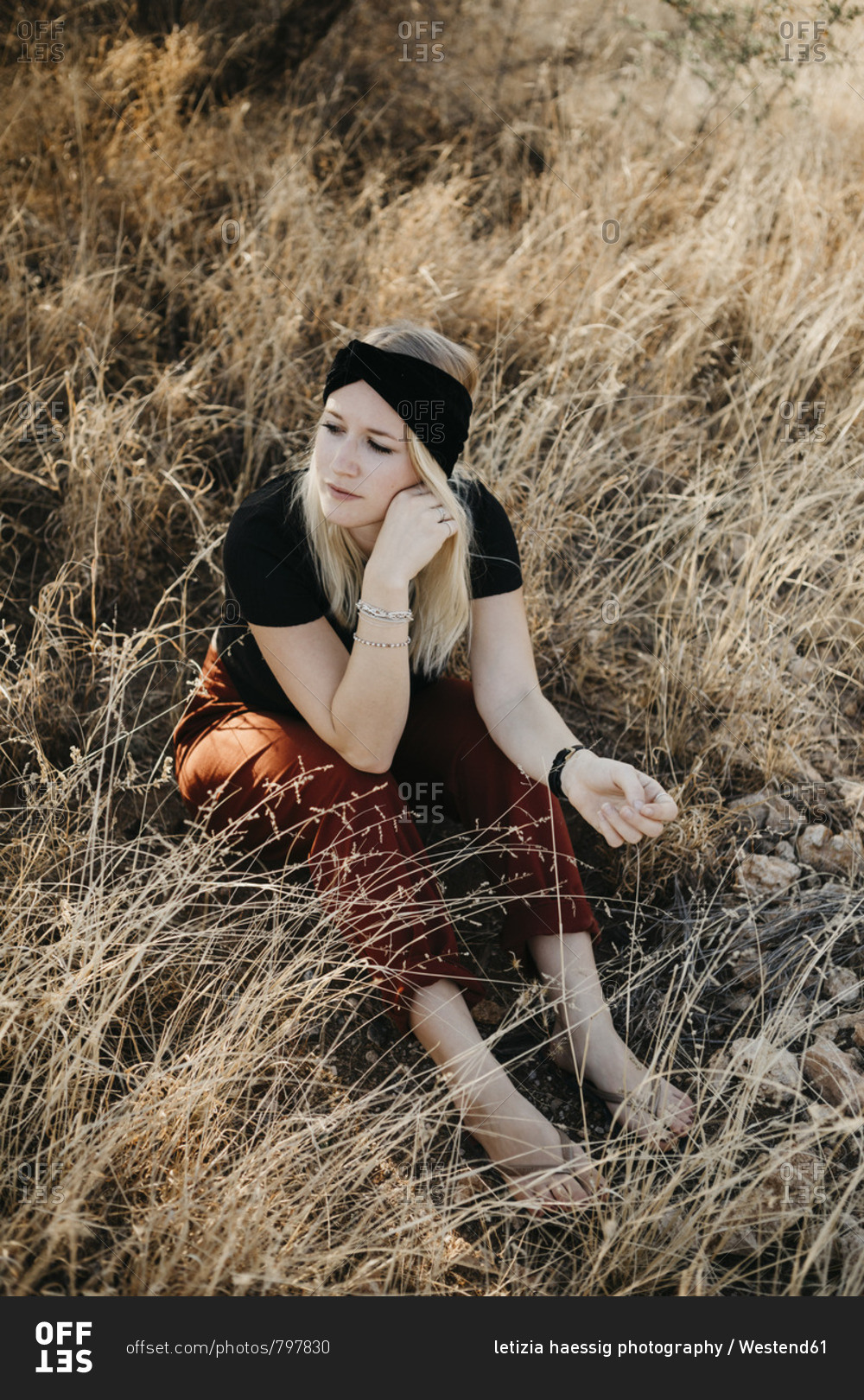 Africa- Namibia- blonde woman in grassland