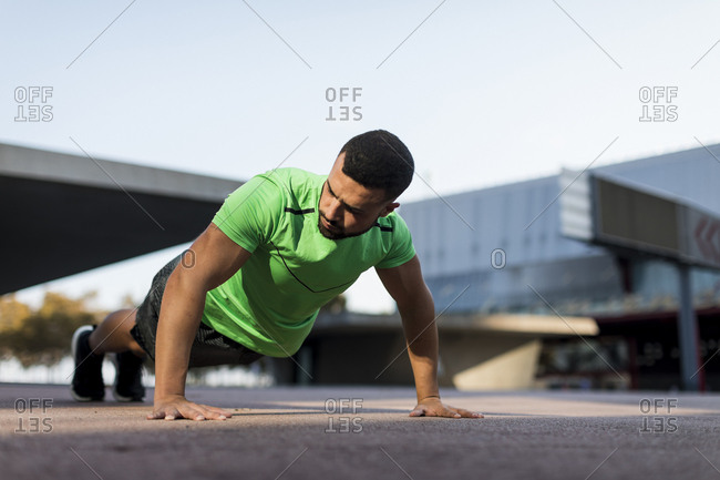 Sportive man during workout- pushup