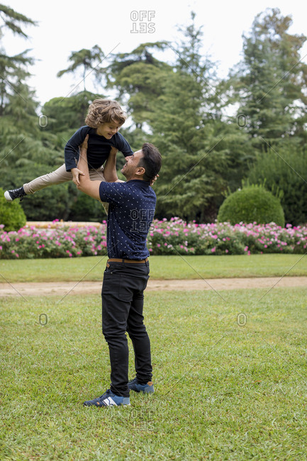 Father and son playing together in park