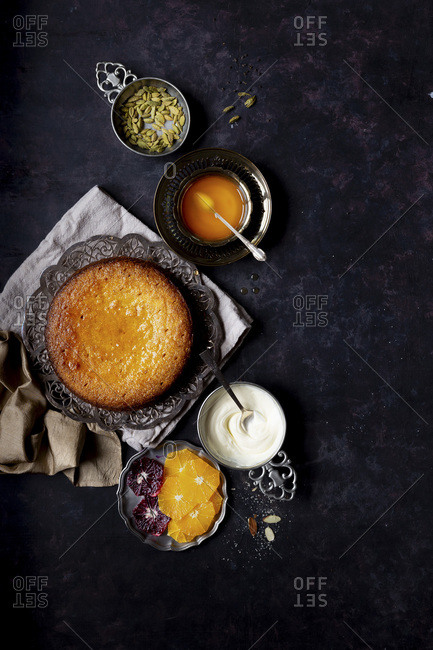 Whole orange olive oil cake with almond and cornmeal, finished with cardamom orange syrup - Gluten-free.