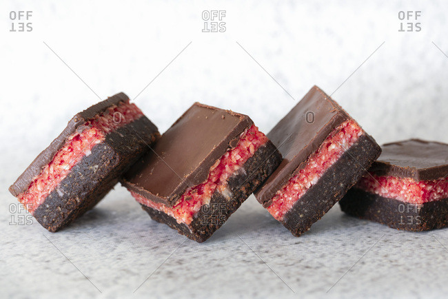Square pieces of chocolate cherry slice.