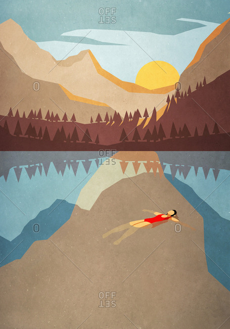 Serene woman floating on back in tranquil mountain lake