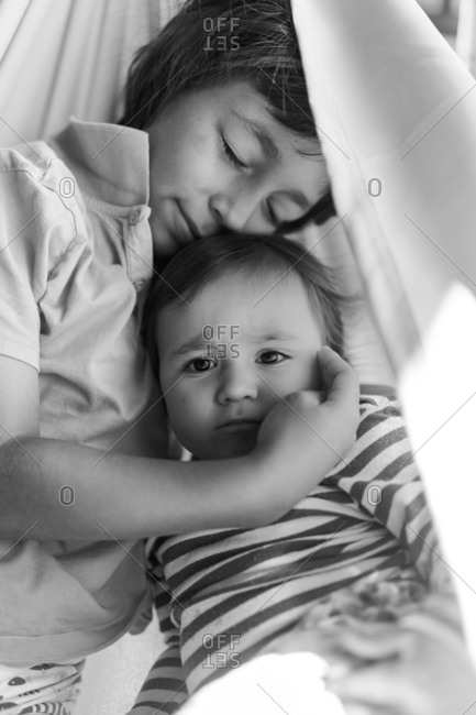 Big brother and baby girl portrait