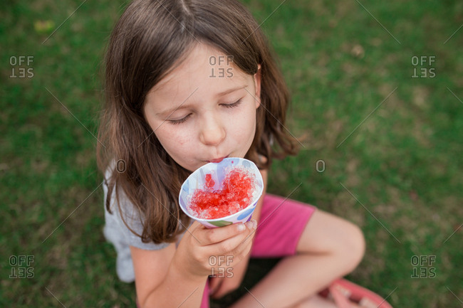 Girl eats snowcone