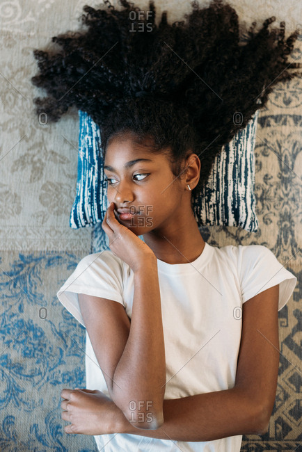 Beautiful Young Black Teenage Girl Lying Down In A Rug Stock Photo Offset