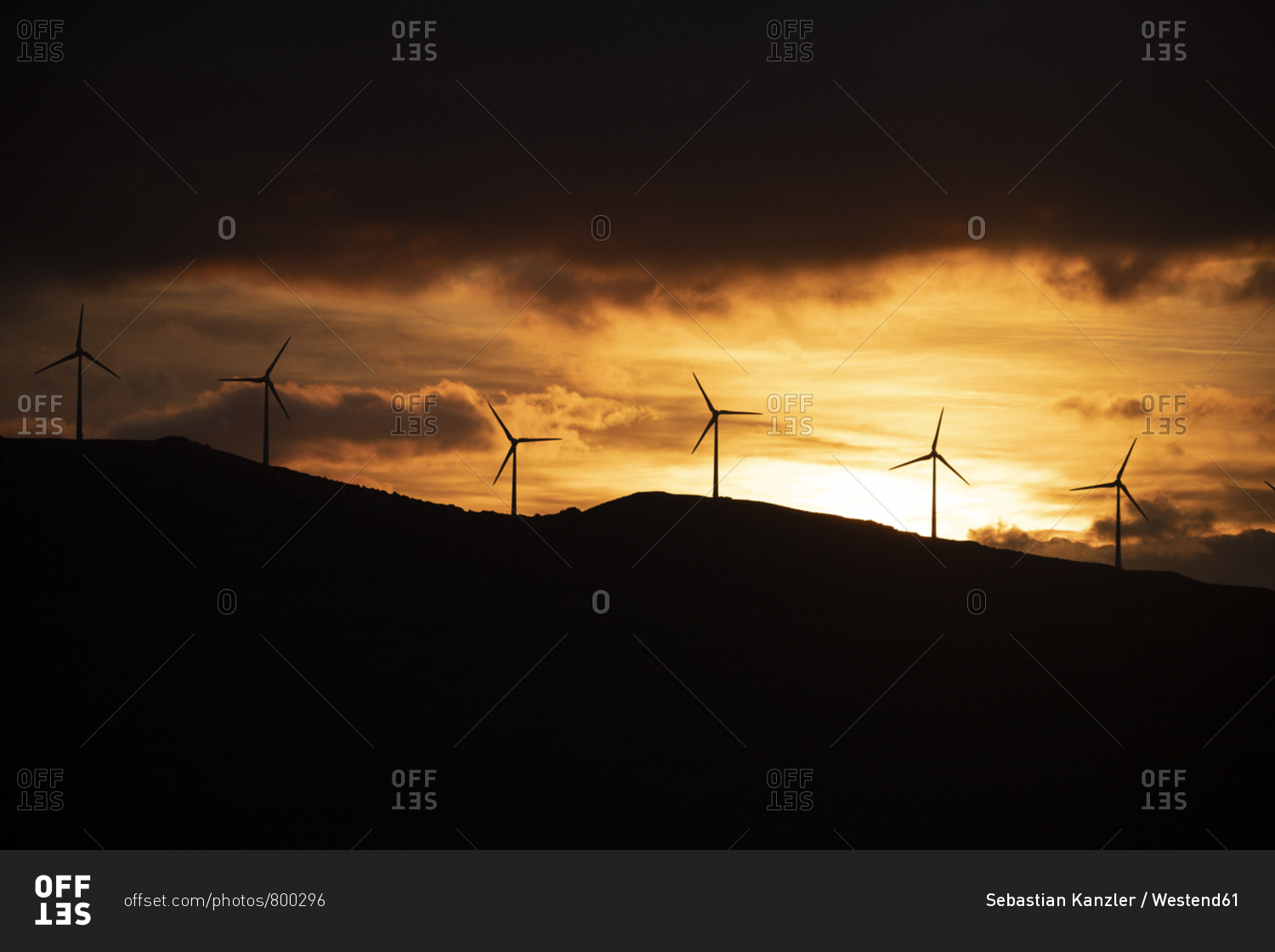Spain- Andalusia- Tarifa- wind wheels on mountain at sunrise