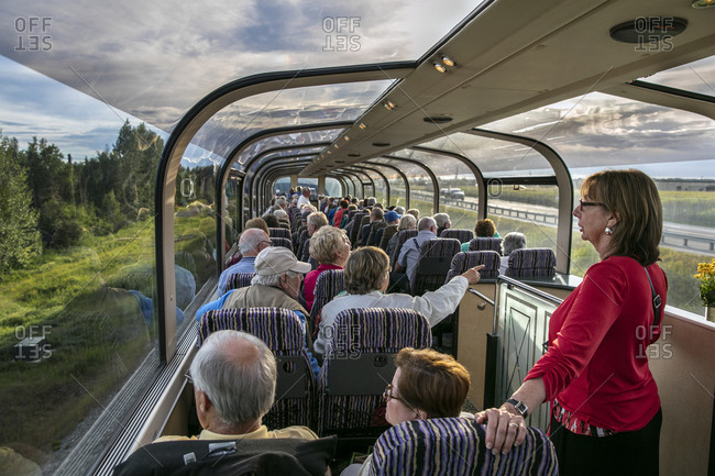 July 1, 2015: USA, Alaska, Denali National Park, the McKinley Explorer can seat 86 to 88 passengers in the upper level dome which offers a 360 degree view, these passengers are traveling the Alaska Railway from Denali to Anchorage