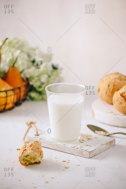 Prepare breakfast with eggs, milk, bread on a wooden table. Milk and egg necessary for growth, health, and good condition. Copy space for your text