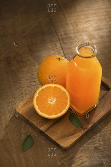 Glass of orange juice from above on wood table. Empty ready for your orange juice, fruit product display or montage.