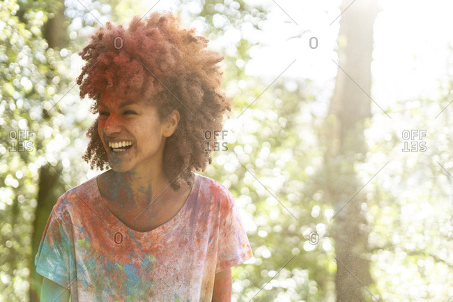 Woman covered in powder paint- celebrating Holi- Festival of Colors