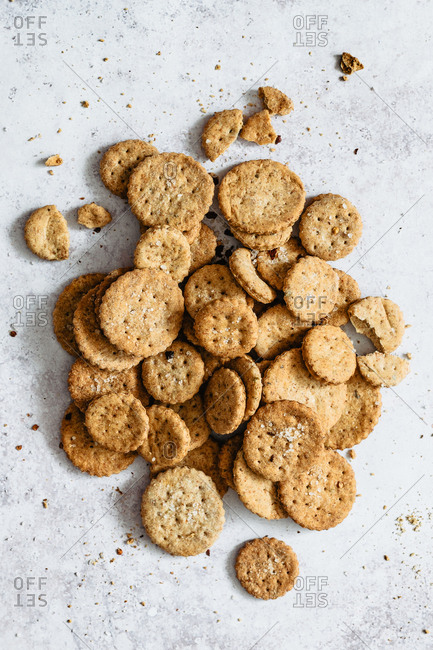 Healthy whole wheat crackers on grey surface