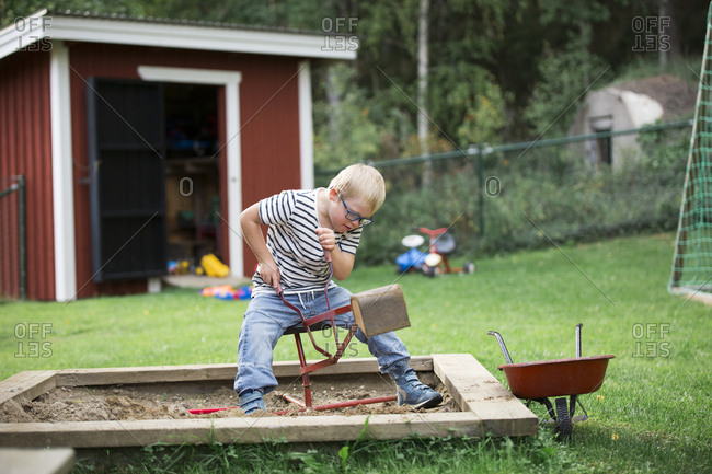 Boy playing in backyard