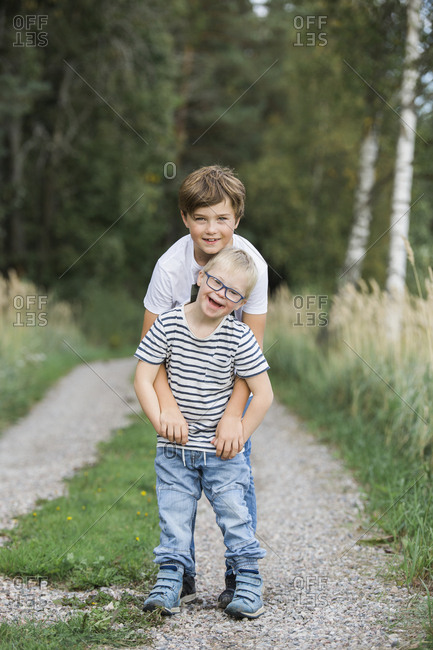 Boys posing in forest