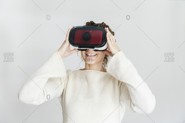 Young woman tries on vr glasses