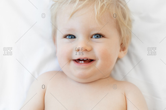 Portrait Of A Cute Baby With Blonde Hair And Blue Eyes Stock Photo Offset