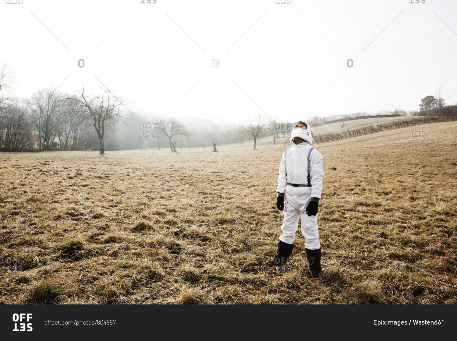 Boy wearing white space suit