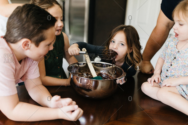 Kids mixing brownies and baking and getting messy
