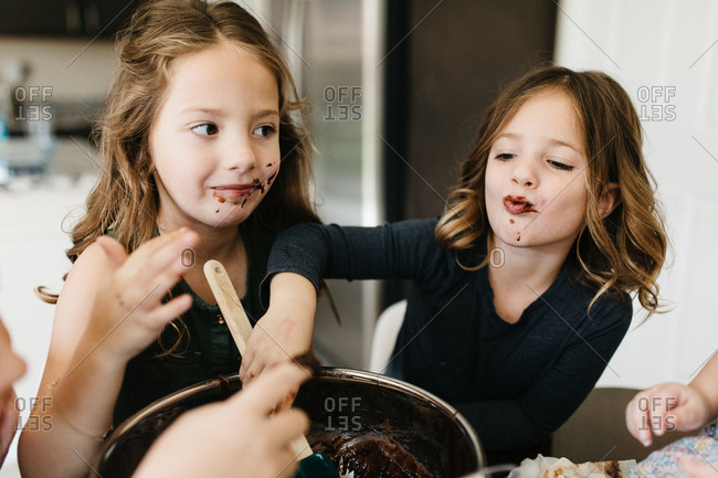 Kids mixing brownies and baking and getting messy