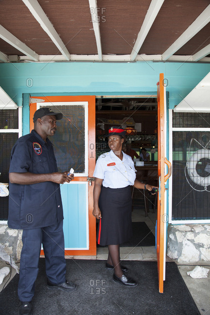 October 27, 2011: EXUMA, Bahamas. A local police woman at the Staniel Cay Yacht Club at Staniel Cay.