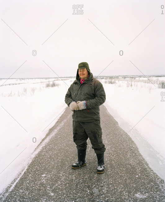 October 4, 2010: FINLAND, Artic, Nunnanen, portrait of senior men standing on road and smiling