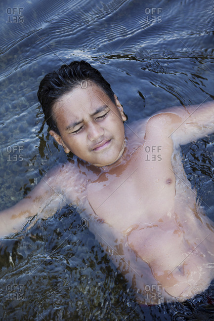 April 6, 2010: FRENCH POLYNESIA, Tahiti. A local swimming hole close to the town of Papenoo along a dirt road towards the center of the island. Favored by local families and kids.