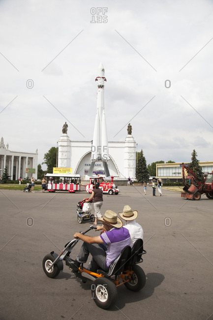July 6, 2011: RUSSIA, Moscow. Visitors at the space pavilion with a copy of the Vostok Rocket at the All-Russia Exhibition Center.