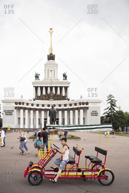 July 6, 2011: RUSSIA, Moscow. Tourists and local visitors in front of the Vladimir Lenin Monument at the All-Russia Exhibition Center.