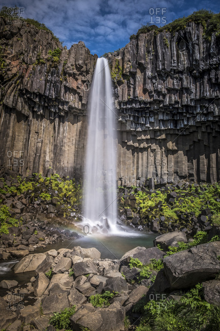 Iceland, South Iceland, Skaftafell National Park, Svartifoss Waterfall - 20 meters tall, the dark columnar basalt formations framing the waterfall and give it its name, Black Fall