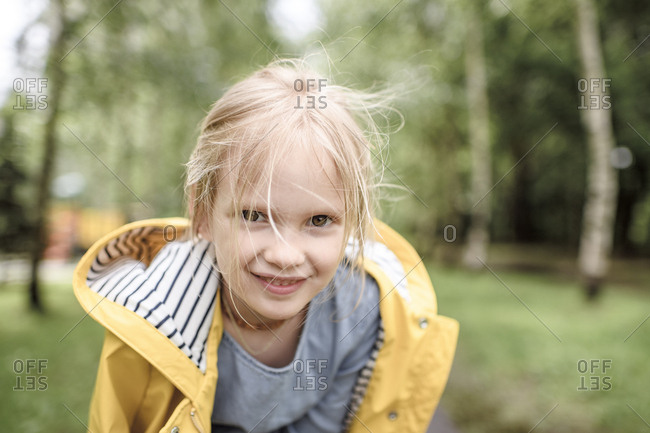 Girl wearing yellow rain jacket