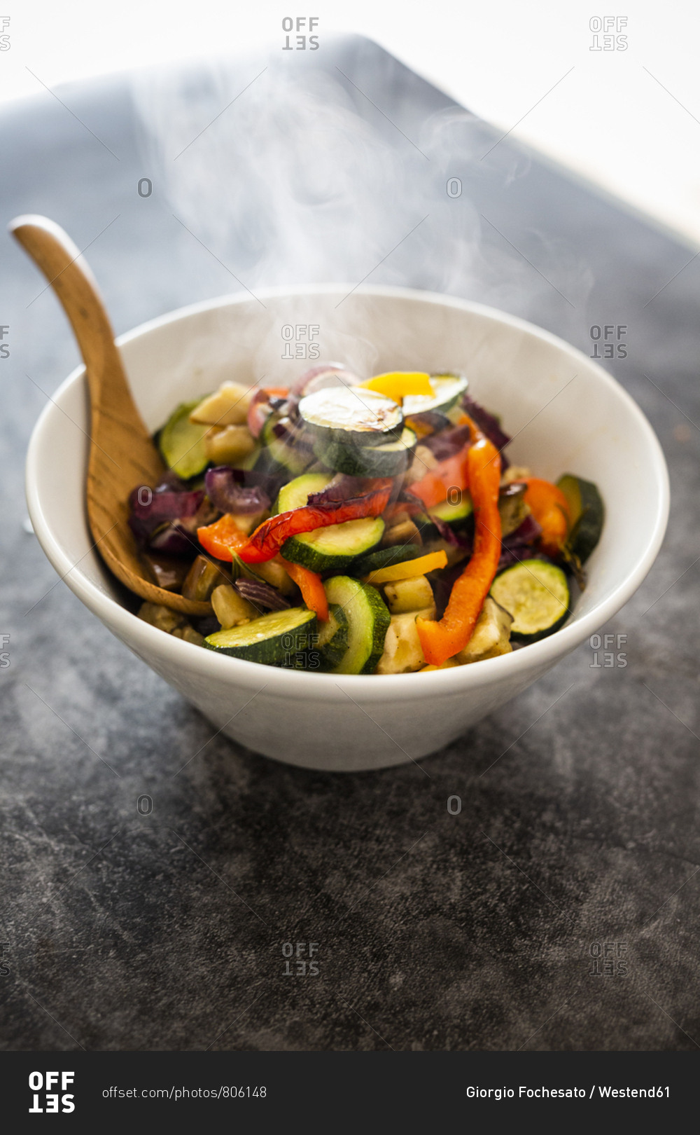 Mix of cooked vegetables in bowl- steaming