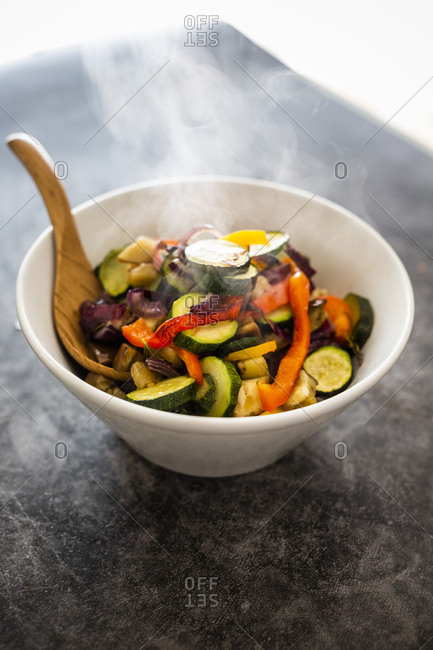 Mix of cooked vegetables in bowl- steaming