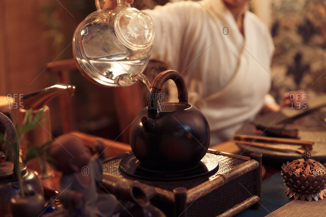 Young women make tea