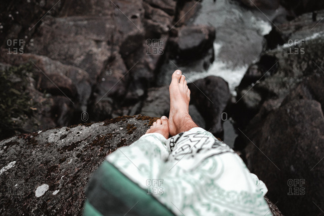 Crop legs stepping in water