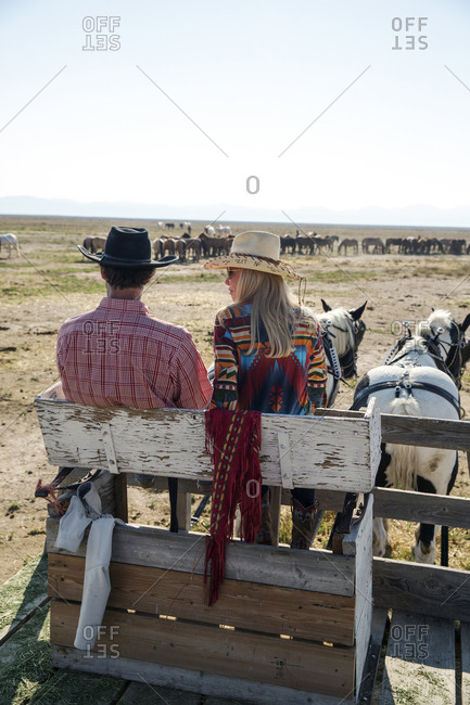 USA, Nevada, Wells, - September 20, 2014:  Founder Madeleine Pickens leads a Horse-Drawn Wagon Ride at Mustang Monument, A sustainable luxury eco friendly resort and preserve for wild horses, Saving America's Mustangs Foundation