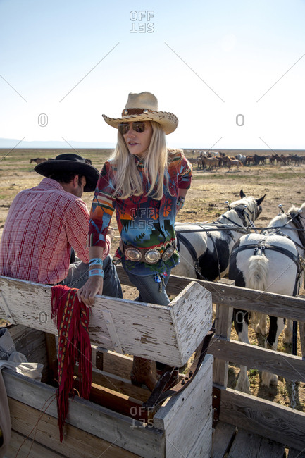 USA, Nevada, Wells, - September 20, 2014:  Founder Madeleine Pickens leads a Horse-Drawn Wagon Ride at Mustang Monument, A sustainable luxury eco friendly resort and preserve for wild horses, Saving America's Mustangs Foundation