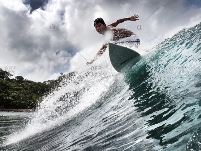 NICARAGUA, San Juan Del Sur, - August 11, 2009:  surfer on a wave at Maderas Beach