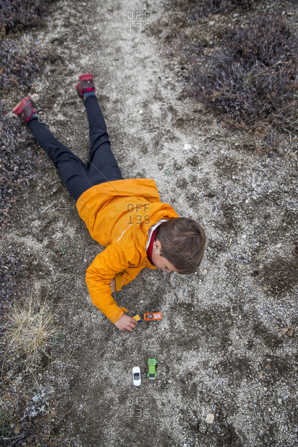 USA, Oregon, Ashland, - October 30, 2014:  portrait of 6 year old Christian Rego aka Buddy Backpacker taking a break while hiking the Pacific Crest Trail near Ashland Oregon with his mom Andrea Rego and Dion, Christian will be the youngest hiker to complete the Pacific Crest Trail in a single season